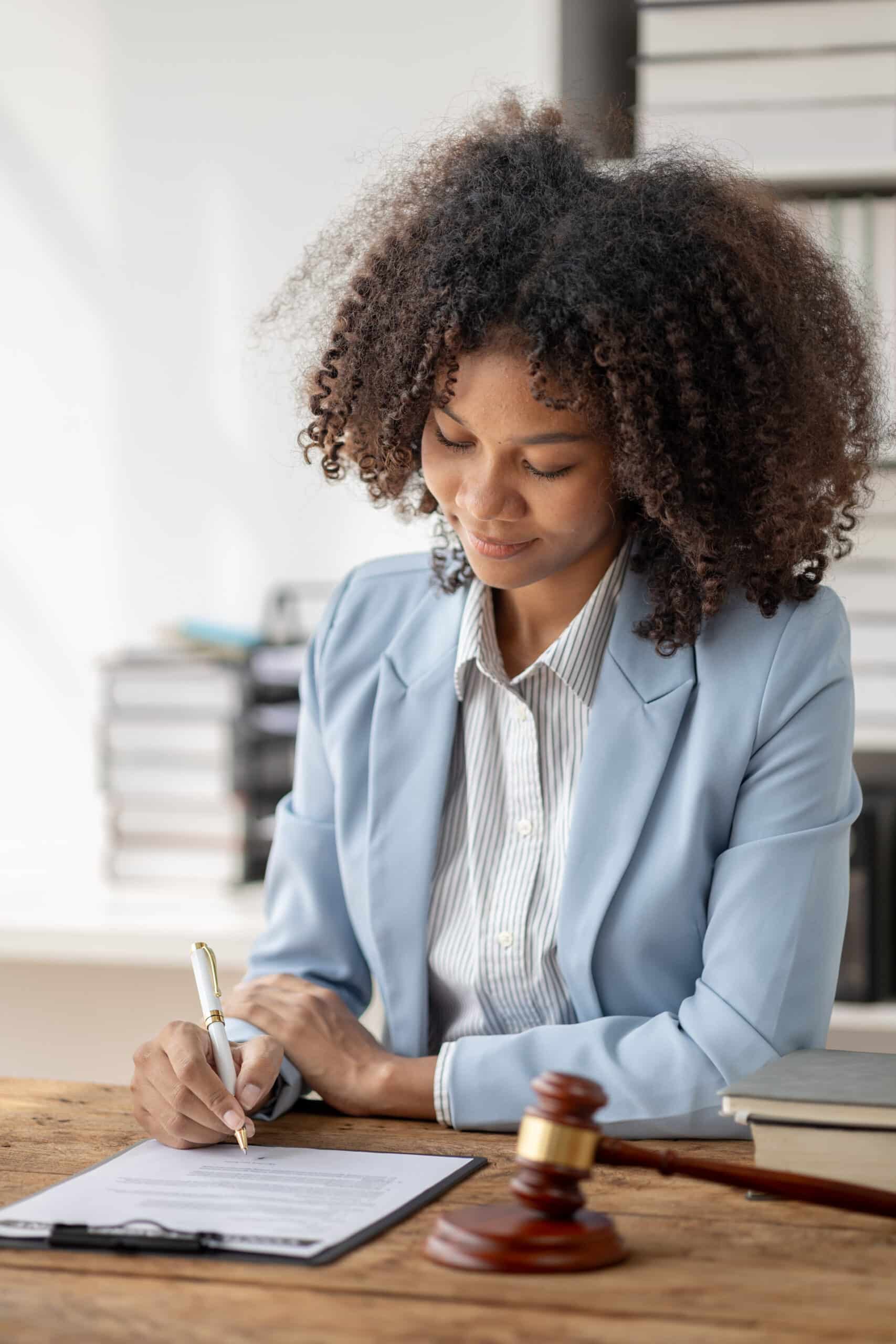 Africann American Woman notarizing document